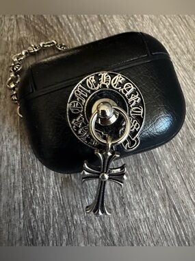Silver Cross Pendant Keychain on Black Case